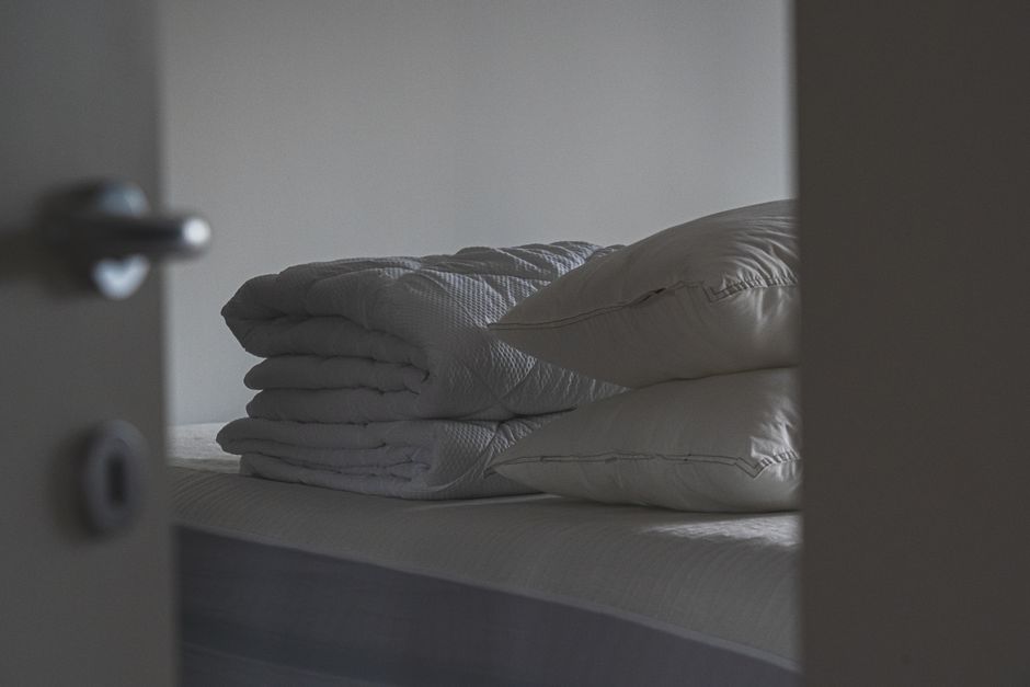 Freshly made bed in a rental